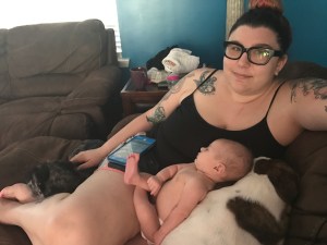 Jessica relaxing with her little girl and fur-babies.